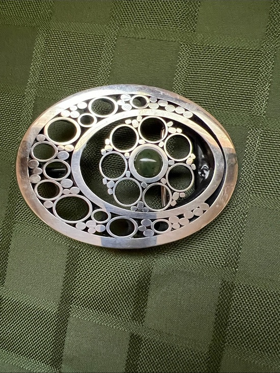 Accessories - Silver Tone Oval Belt Buckle with Cutout Circles and Central Green stone
